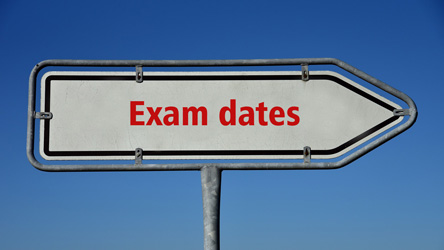 Signposts with the lettering "Exam dates